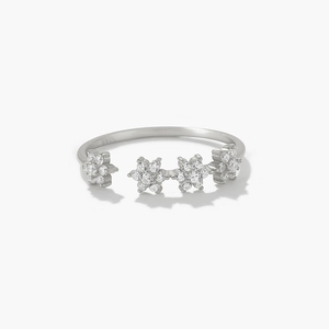Detail shot of four consecutive floral motifs inlaid with sparkling cubic zirconia crystals