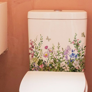 Detailed view of floral toilet tank decals with wildflowers and butterfly motifs