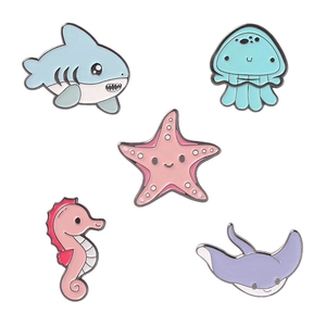 5-piece sea animal enamel pin set featuring shark, seahorse, starfish, jellyfish, and ray