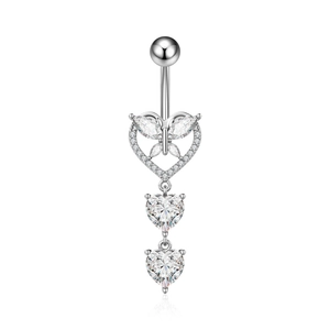 Close-up of silver navel piercing with heart and butterfly pendant with white zircons