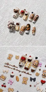 Macro detail of 3D embossed bear baking nail art stickers with cute dessert patterns