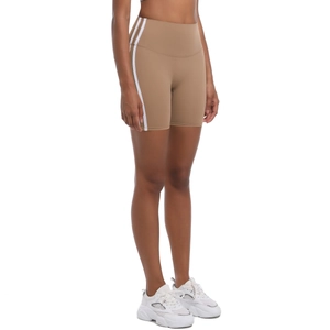 Detail of high-waisted khaki yoga shorts featuring classic white side stripes and stretch fabric