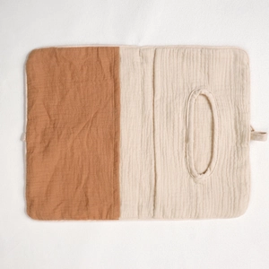 Detailed macro of a two-tone muslin cotton baby organizer with a practical oval opening