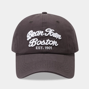 Close-up of Bean Town Boston white 3D embroidery on a vintage brown cotton baseball cap