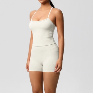 Detail view of high-waist yoga shorts with side pocket and slim fit tank top set