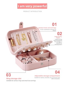 Pink PU leather jewelry box detail with sections for necklaces, earrings, and rings