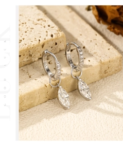 Macro shot of S925 sterling silver marquise-cut water drop earrings with tiny crystals