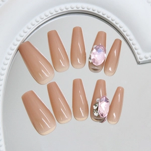 Pink glitter coffin press-on nails with luxury diamond and pearl charms on heart mirror