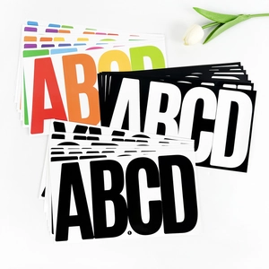 Pile of colorful 6-inch waterproof alphabet stickers in various vibrant colors