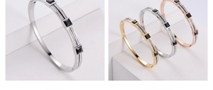 Macro shot of geometric open bracelet with black square stones and micro pave diamonds