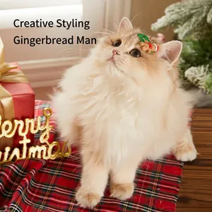 Cute gingerbread man and wreath pet hair clip worn by a cat for Christmas party