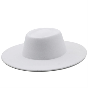 Detailed view of the fine wool felt texture on a minimalist white wide-brim fedora hat