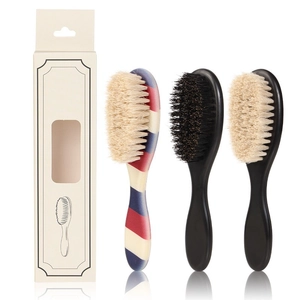 Barber grooming kit with three natural bristle beard brushes in a premium gift box