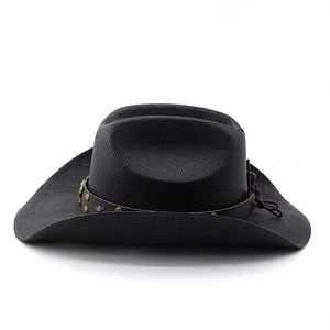 Detail of black woven cowboy hat featuring vintage rivets on a brown leather band