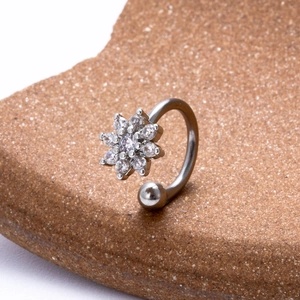 Silver C-shaped surgical steel lip ring with zircon flower and round metal bead