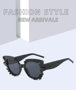 Close-up of irregular jagged black frame fashion sunglasses for trendy parties