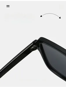 Detailed close-up of durable metal hinge structure on square black sunglasses