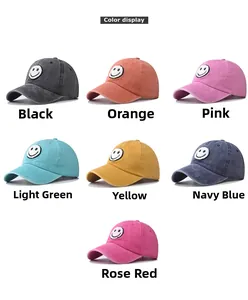 Color display of washed cotton baseball caps with embroidered smiley face patch