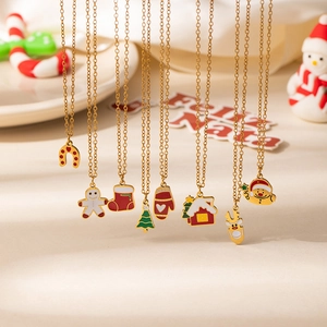 Close-up of assorted gold Christmas pendants featuring Santa, reindeer and gingerbread man