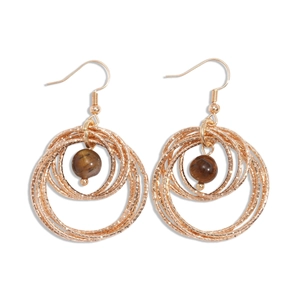 Rose gold layered hoop earrings with tiger eye stone center in a vintage style