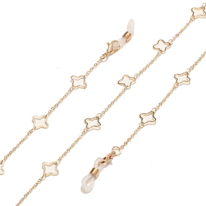 Golden eyewear chain with white four-leaf clover motifs and anti-slip silicone loops