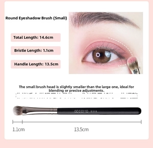 Macro view of a small round eyeshadow brush with soft bristles and exact dimensions