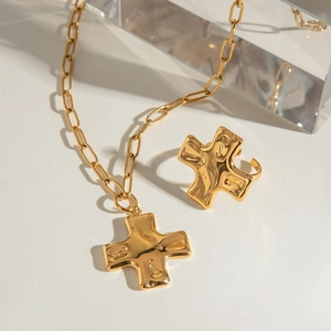 Golden stainless steel necklace and ring set with irregular hammered cross pendant design