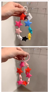 Close-up of colorful silicone star-shaped pendants and keychains for phones and bags