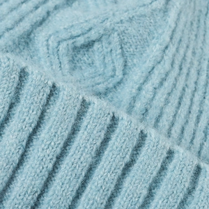 Sky blue knit beanie featuring thick diamond cable patterns and soft fuzzy mohair texture
