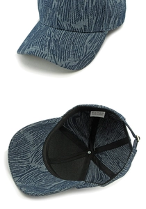 Detail view of denim texture baseball cap inner lining with washing care label