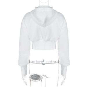 Back view of a white cropped hoodie featuring long sleeves and a ribbed hem texture