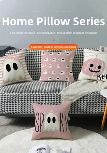 Detail of pink Halloween throw pillows with ghost and spooky prints on checkered sofa