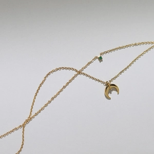 Double-layered gold titanium necklace featuring green crystal and crescent moon pendant