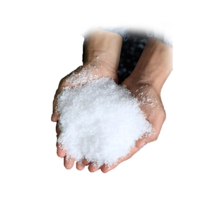 Artificial dry snow powder held in hands for Christmas decoration and display scenery