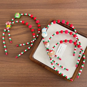 Handmade Christmas beaded headbands with festive Santa, elk and snowman charms for kids