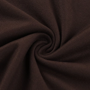 Macro detail of dark brown stretchy knitted fabric with soft texture and elegant drapes