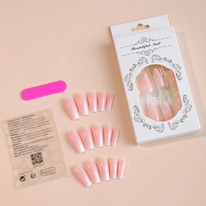 Detail view of pink gradient coffin nails set with adhesive tabs and nail file kit