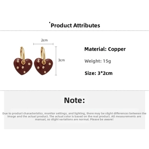 Detail showing red heart pendant earrings size 3x2cm with crystal inlay and gold hoop
