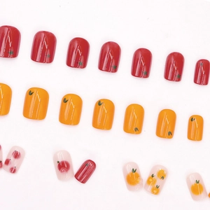 Cute fruit-themed short round press-on nails with tomato and citrus orange patterns