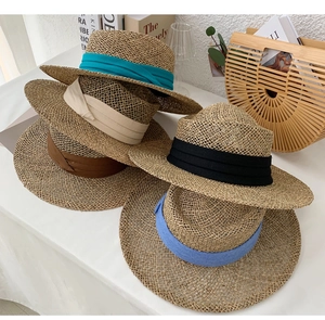 Straw sun hats collection featuring colorful bands in blue beige and black styles
