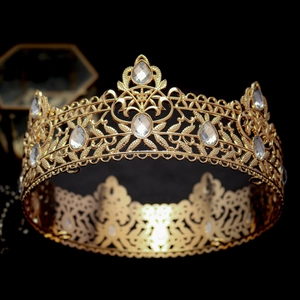 Macro shot of luxury gold baroque crown with intricate metalwork and sparkling crystals