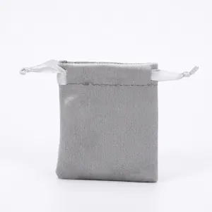 Detail of gray velvet jewelry pouch with soft texture and silk drawstring closure