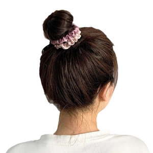 French style satin silk scrunchie in purple and pink displayed on a hair bun