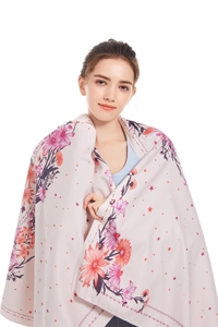 Detailed pattern view of the floral microfiber beach towel with star accents and soft texture