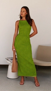 Detail shot showing the textured fabric and bodycon fit of the green backless maxi dress