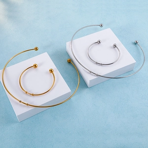 Minimalist open collar necklace and bracelet set in polished gold and silver steel