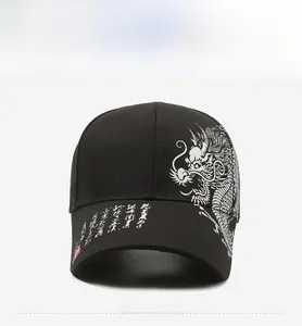 Detailed view of black cotton baseball cap with white dragon embroidery and calligraphy art