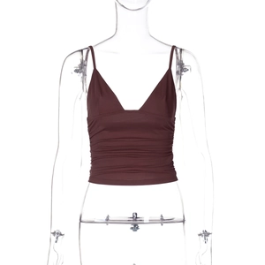Close-up of brown V-neck camisole featuring stylish ruched fabric details on a mannequin