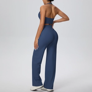 Detail of dark blue halter neck yoga top and loose straight pants fitness set