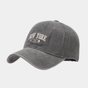 Detail view of New York 1625 embroidery on washed cotton dark grey baseball cap